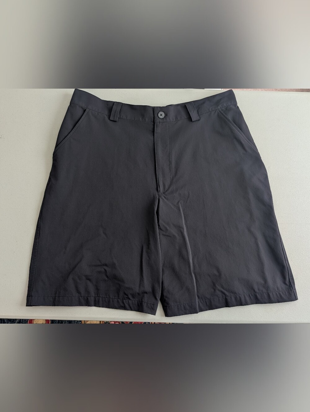 Under Armour black shorts, size 36